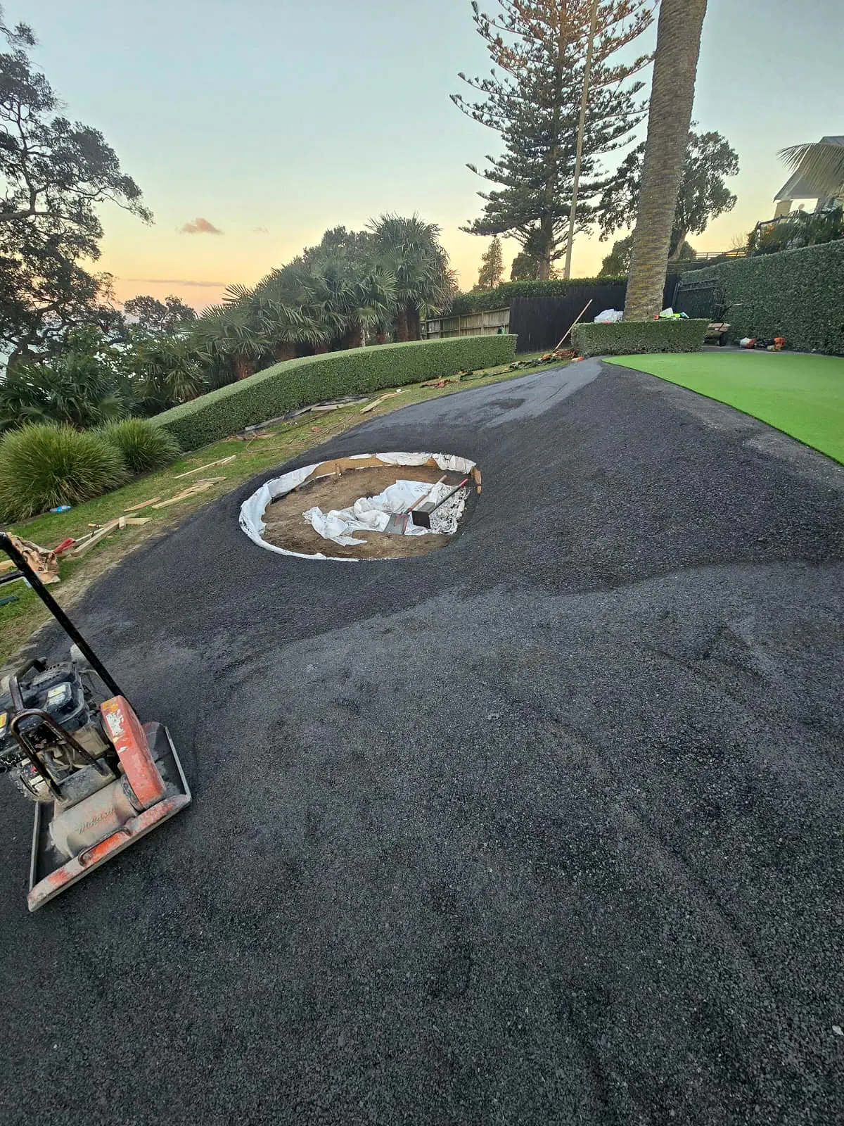 Compacted base prepared for a custom mini golf putting green
