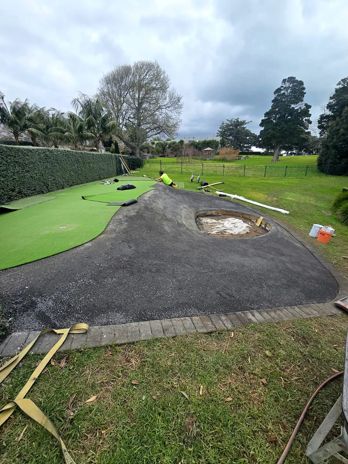 Mini golf artificial turf installation progressing around the putting green